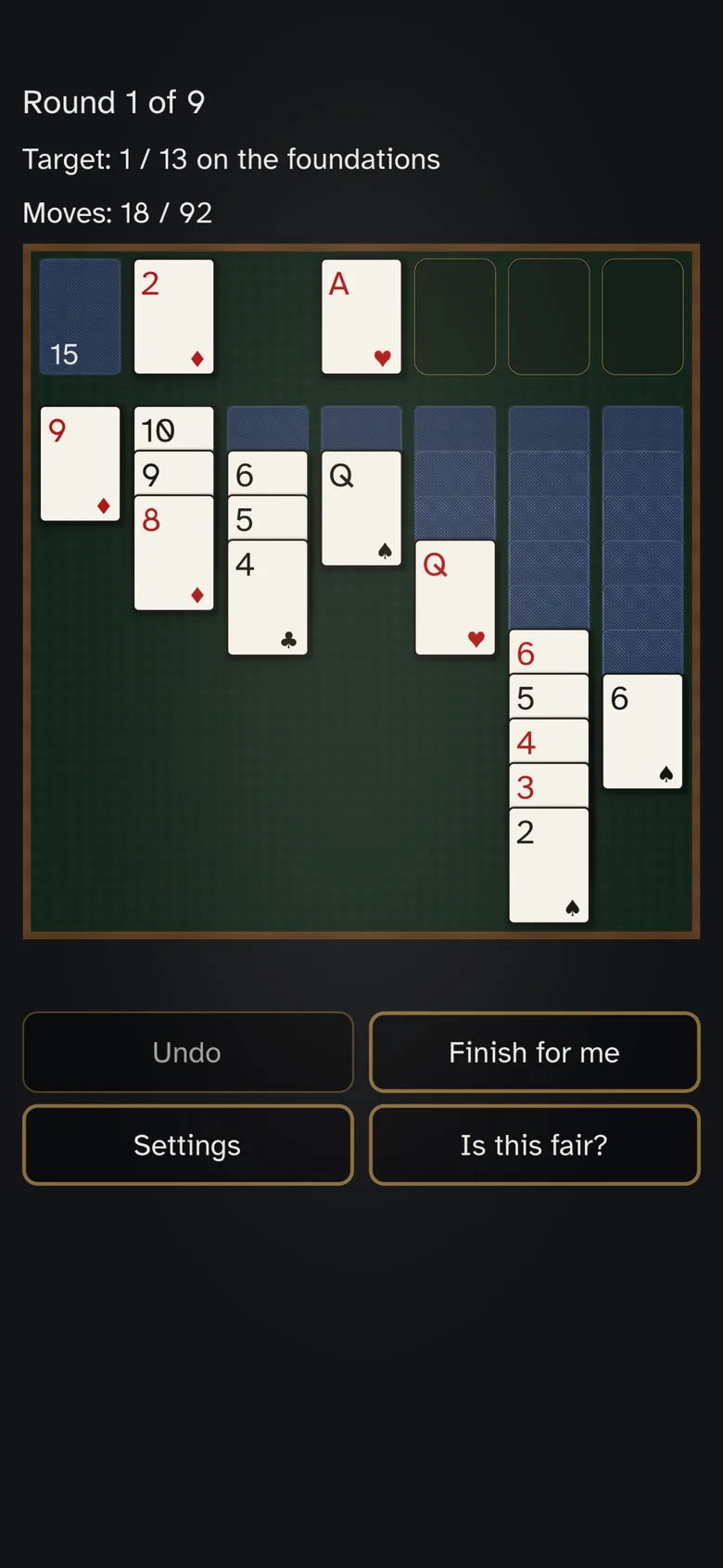 A Klondike table: stock and waste at the left, four foundations at the right, seven columns below with the face-up cards stepped so their ranks stay readable.